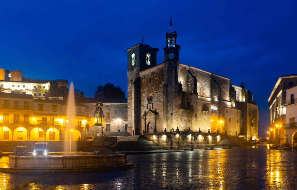 Illuminated Plaza Mayor in evening, Trujillo, Spain