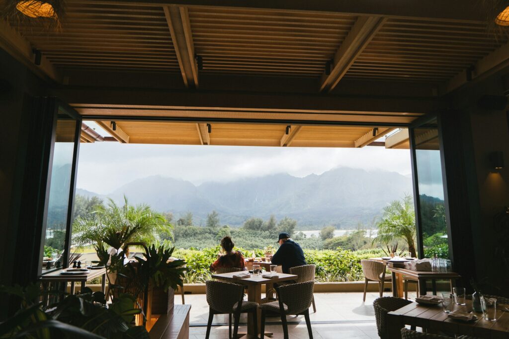 a man and woman sitting at a table in a restaurant
